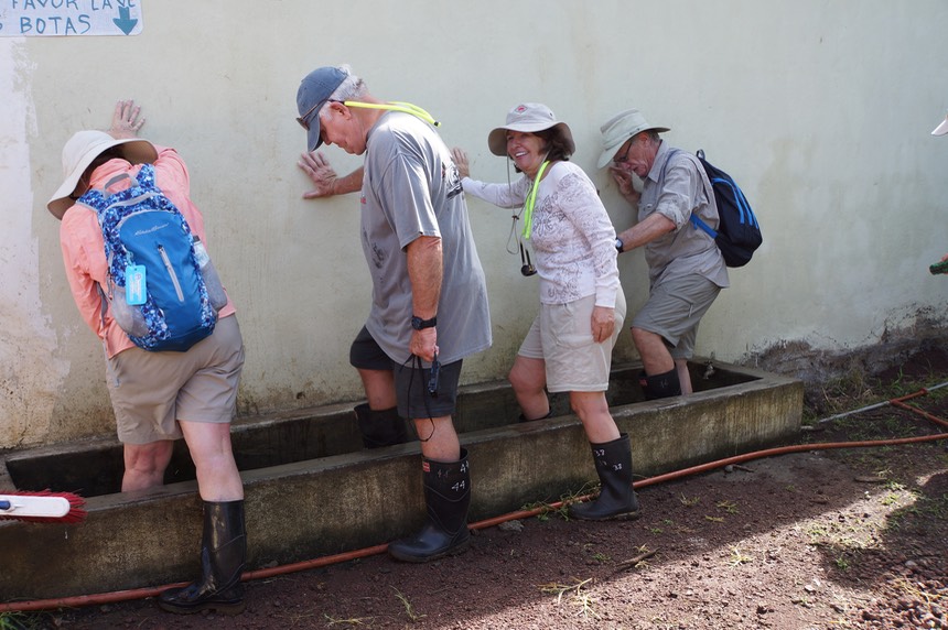 140308 22 Santa Cruz Tour Day Stop 2 Primicias Ranch of Giant Tortoise Boot cleaning time